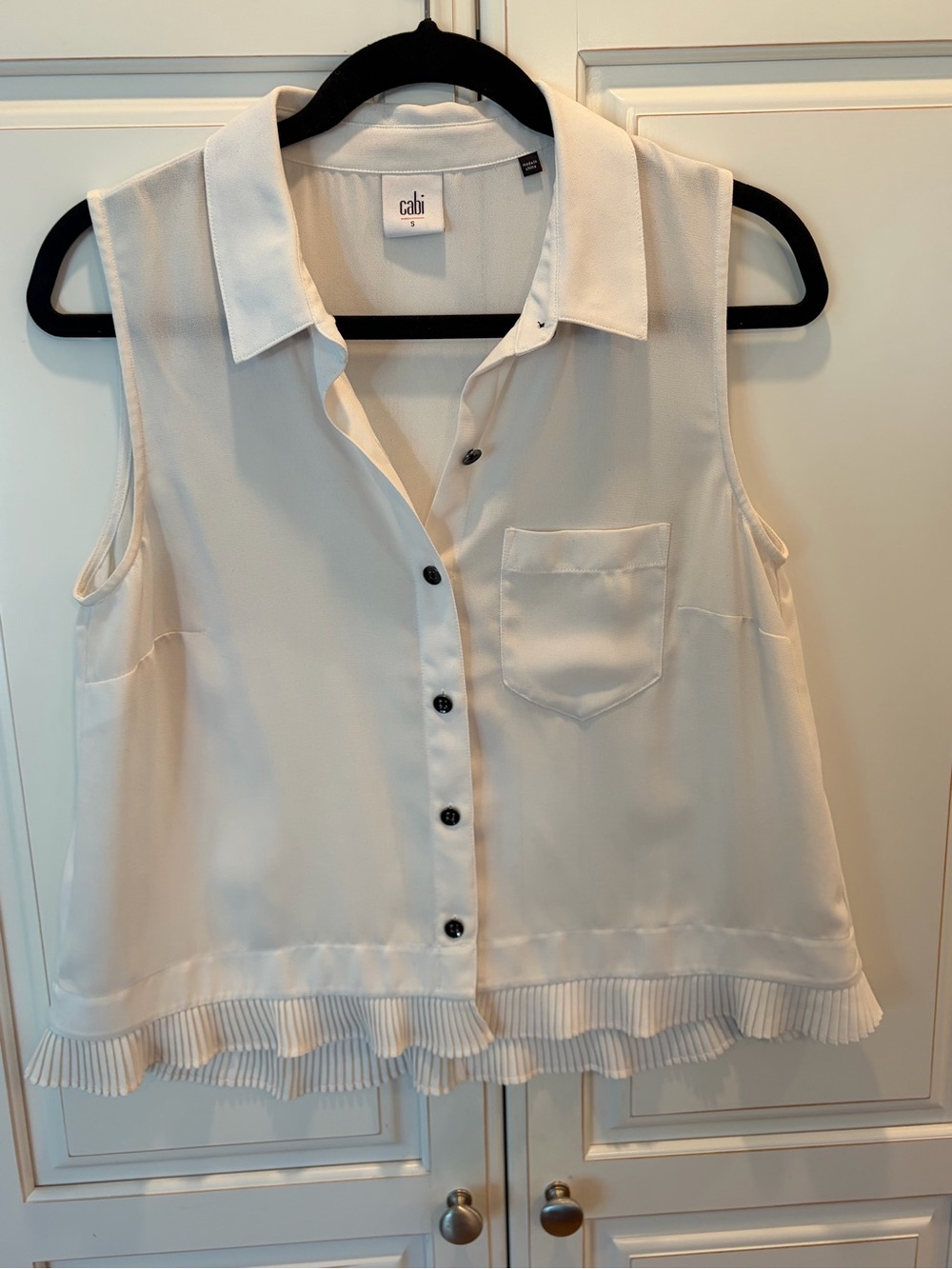 CAbi Ivory Sleeveless Button-Front Blouse with Pleated Hem